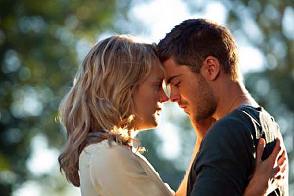 the lucky one stars Zac Efron and Taylor Schilling, who fall in love after Logan Thibault (Efron) finds a picture of Beth Clayton (Schilling) during his tour in Iraq.