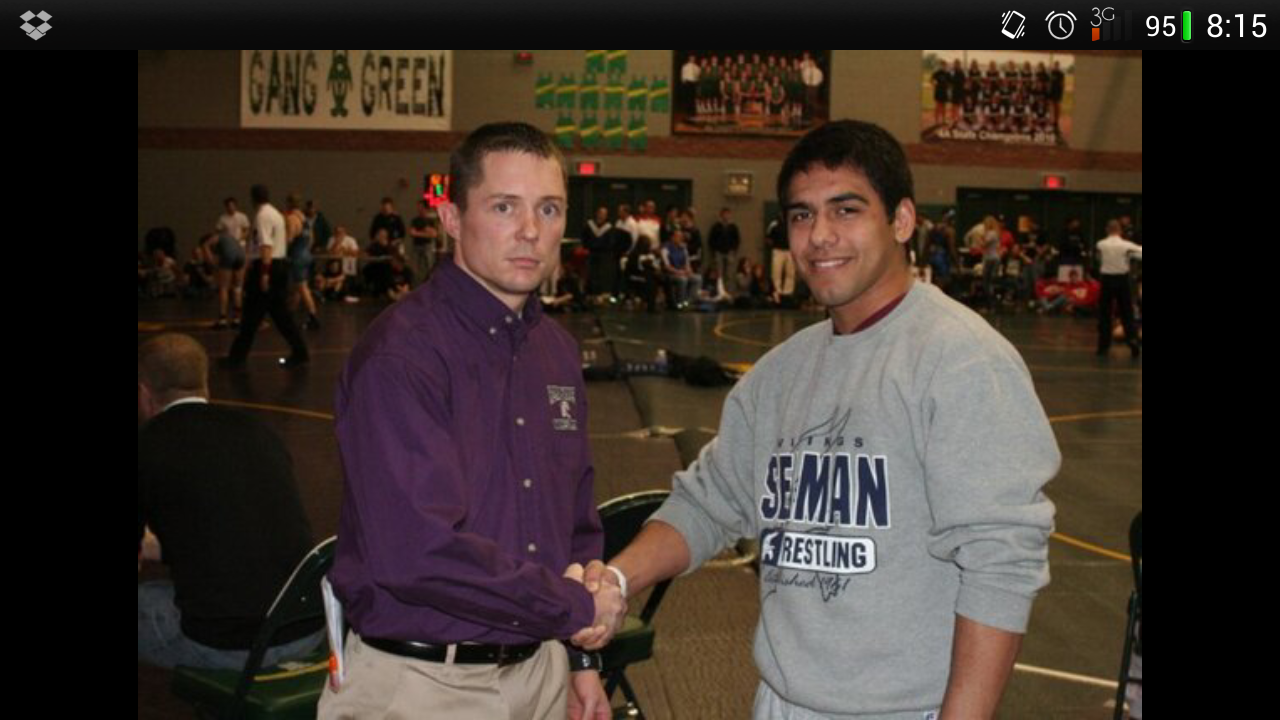 Jason Puderbaugh,former Seaman all-time winner and current Royal Valley coach, congratulates Bryant Guillen.  Guillen broke the record held by Puderbaugh since 1998.