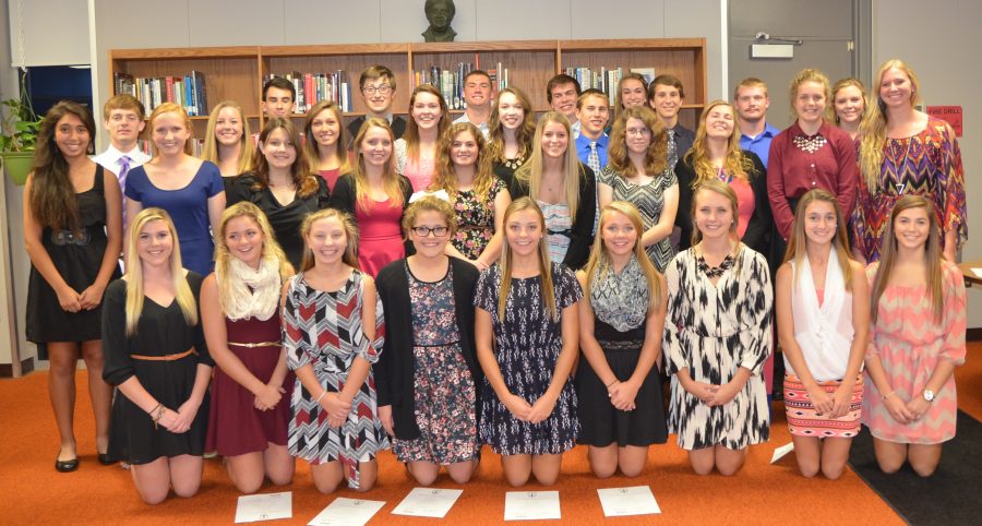 NHS inductees cheesing for a group picture. 