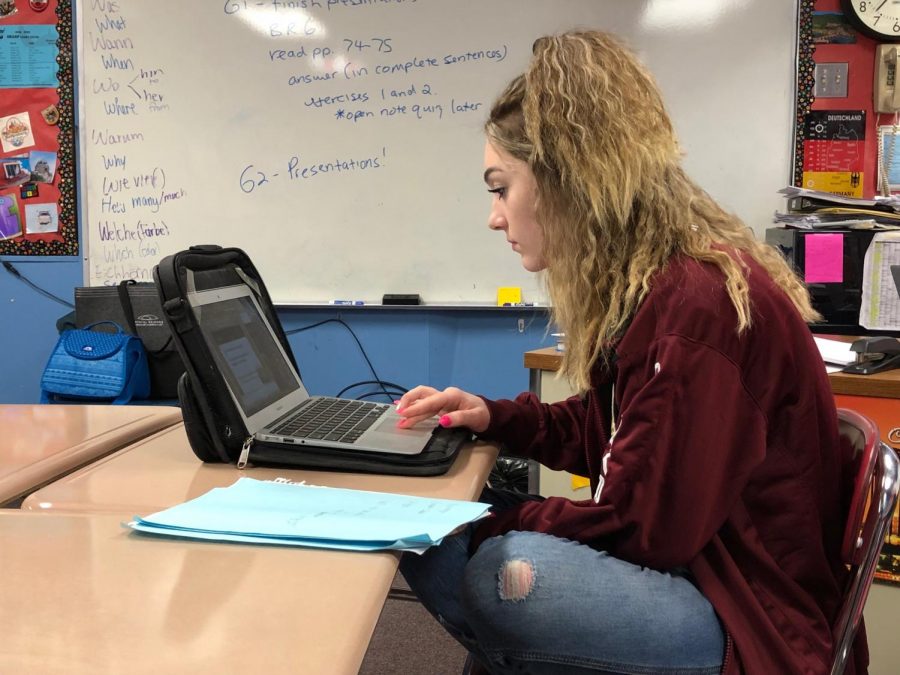 Kalie Kleiner, sophomore, working hard on a Berlin presentation about the Sachsenhausen Konsentrationslager, concentration camp. Kleiner believes school has been more stressful than Freshman year, saying, I do not agree to the Sophomore year is the easiest year saying.
(Photo by Alyssa Boos)