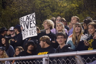 A student from Topeka High School holds a poster that says, Black Lives Matter. 