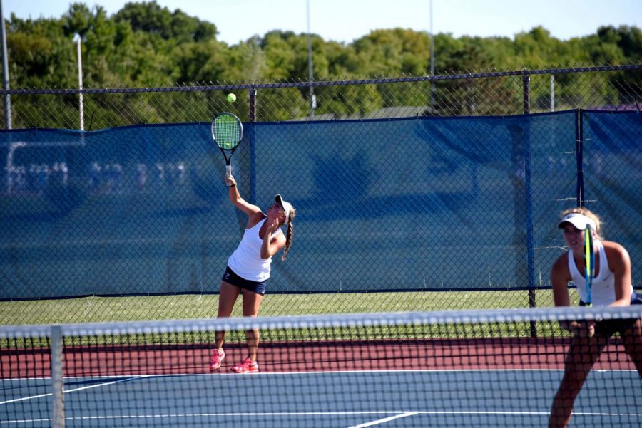 Lauren Sweeney serves the ball. Sweeney and her doubles partner, Grace Unruh, got 1st place at the State tournament. 