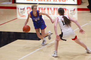 Freshman Anna Becker dribbles a ball at the December 10th game against Emporia. The Lady Vikes are set to matchup with Emporia again on February 25, 2021, at home (Seaman High School). 