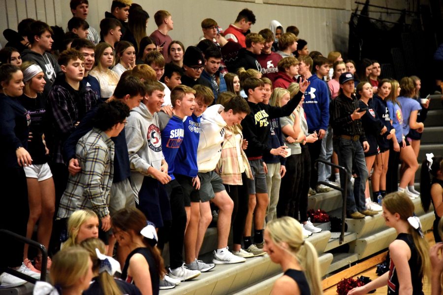 The+student+section+cheers+during+the+third+quarter+of+the+boys+basketball+game+on+December+7%2C+2021.+This+was+the+first+game+that+the+student+section+was+moved+to+behind+the+end+zone.