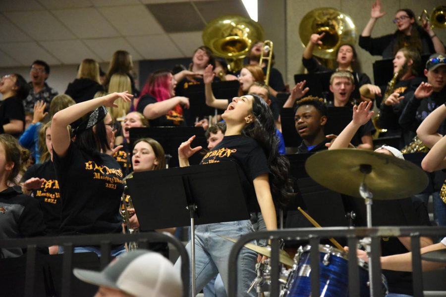 Senior Ellie Noble rocks out to the Seaman High School bands performance during the halftime show on Feb.  18, 2022. 