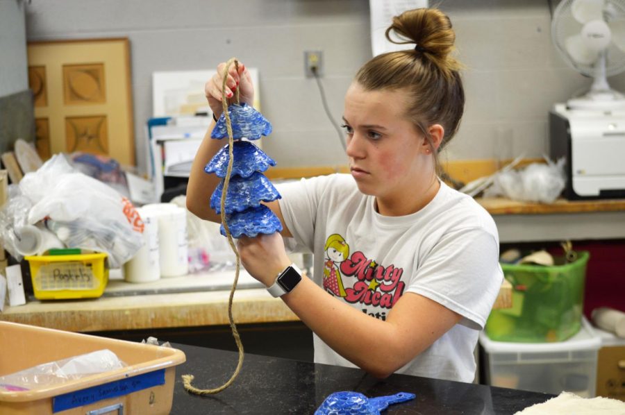 A Seaman Viking concentrates on fixing her ceramics art project during class. (2021-2022 Best Academic Photo)